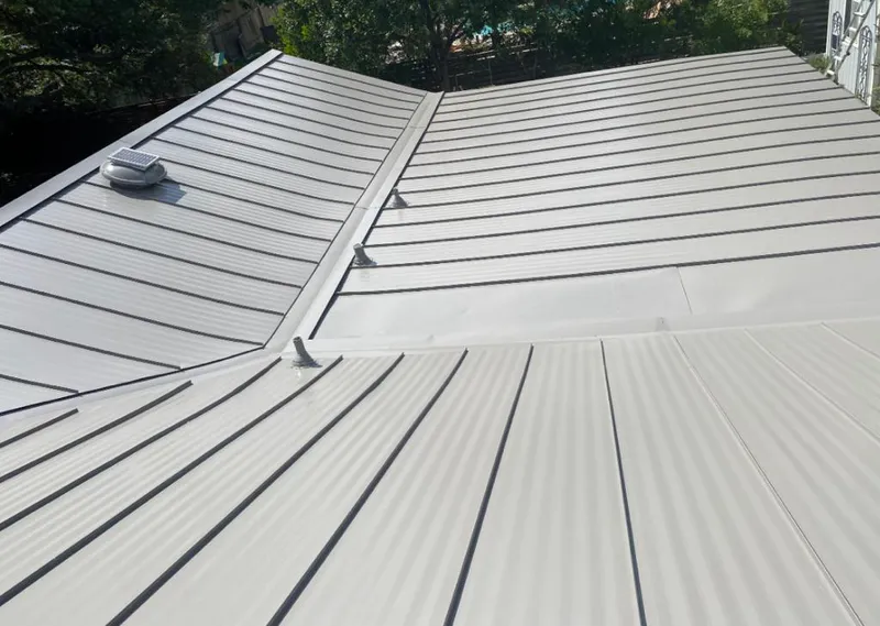 Solar attic fan installed on a metal roof for Roof Ventilation in Grass Valley